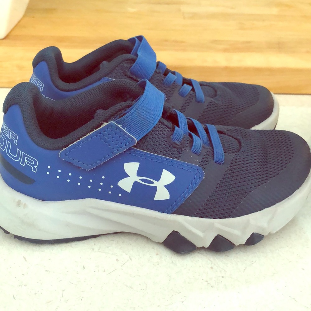 Kids gently used Under Armour athletic shoes.